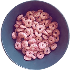 A bowl of Essential Red Berry Crunchy O's Cereal
